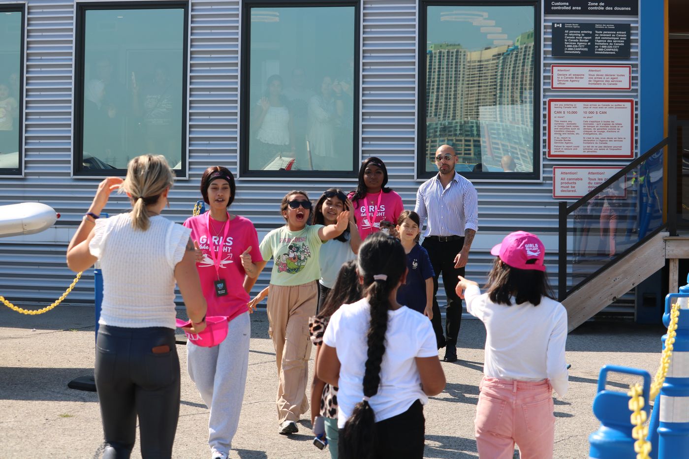 Participants and volunteers gathered outside the FBO