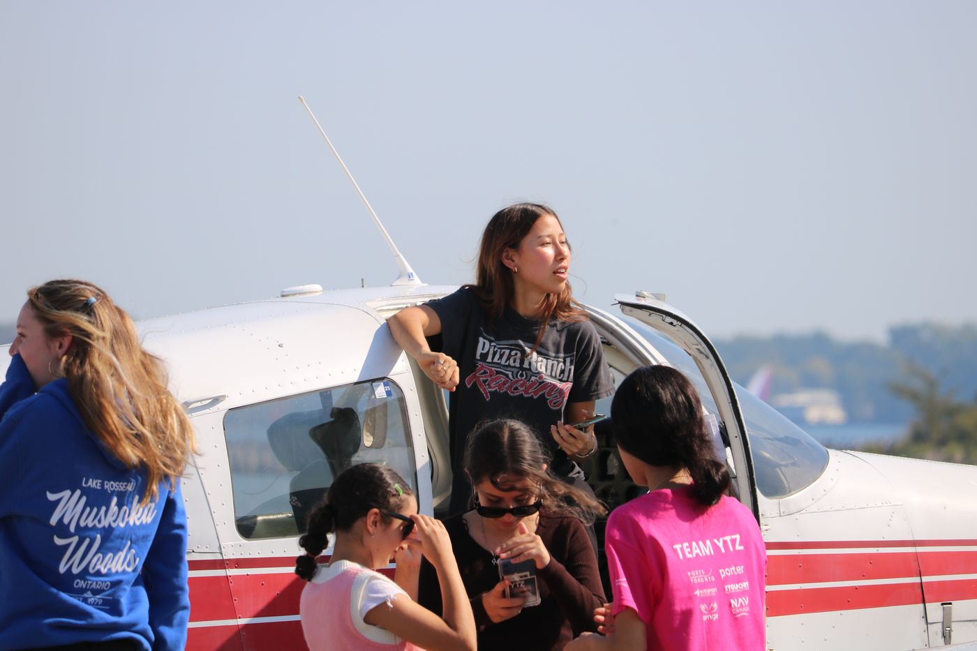 Participants gathered at the aircraft door before boarding
