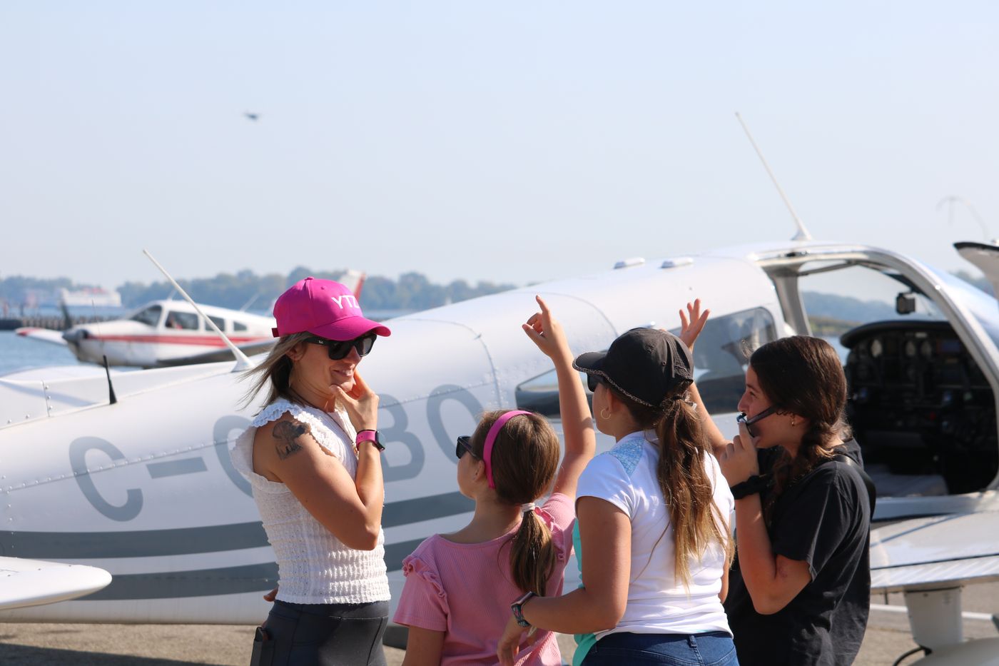 Participants pointing out the flight route before takeoff